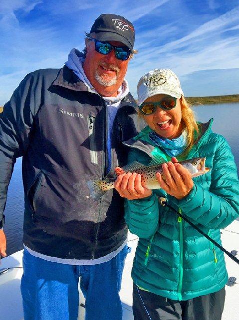 Wanda Hair Taylor with Gary Dubiel, releasing one of a hundred trout caught in Gary's home waters