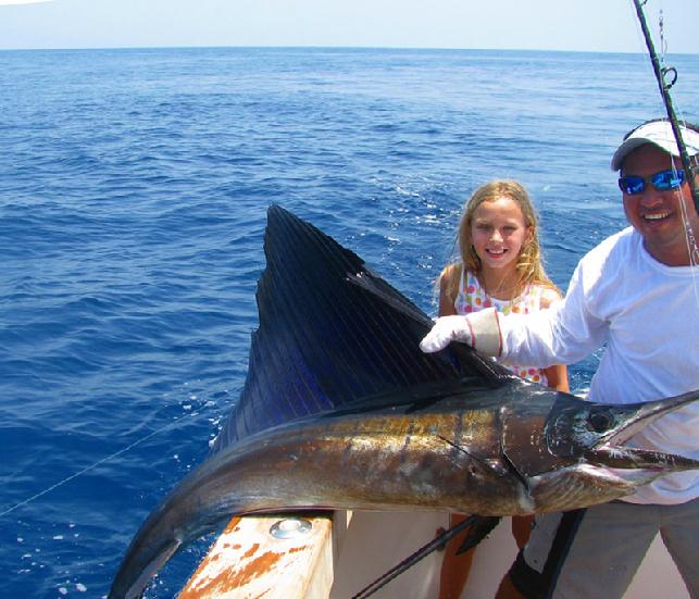 7 year old girl catcges several Sailfish