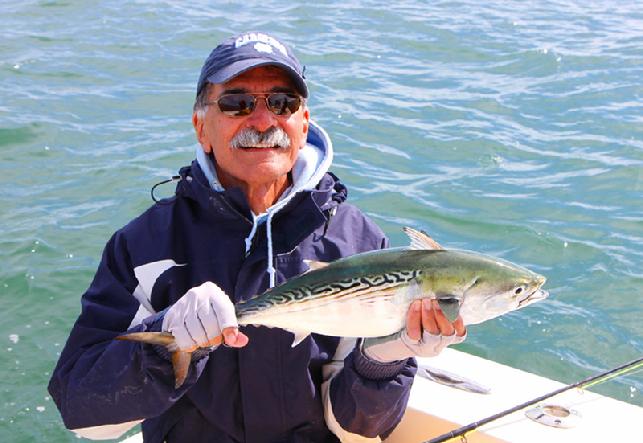 Eli releasing Fat Albert CApe Lookout November 9 2013 Vessel Fly Reel