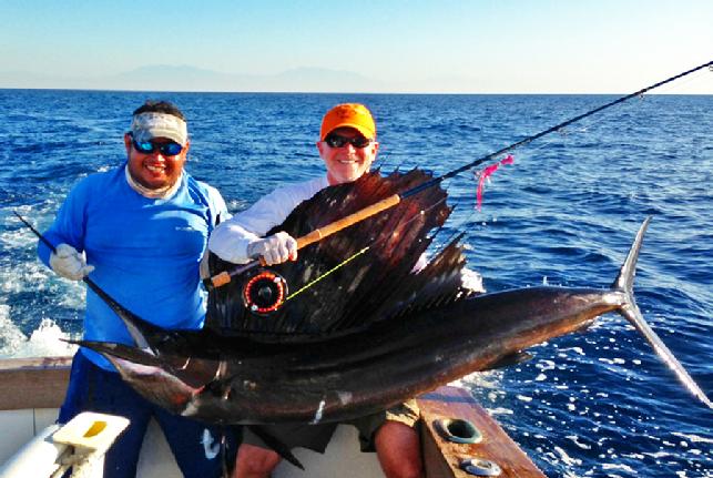 Captain Jake Jordan's "The Sailfish School" with student angler Paul McGarvie January 10, 2013